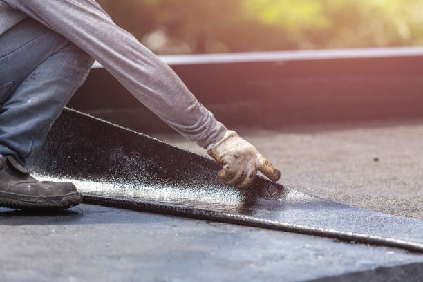Professional Basement Waterproofing technician working in East Pembroke, NY